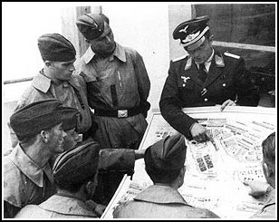 German pilots get a briefing prior to a mission